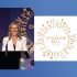 Woman speaking at Childline Ball 2026, charity event for children's welfare.
