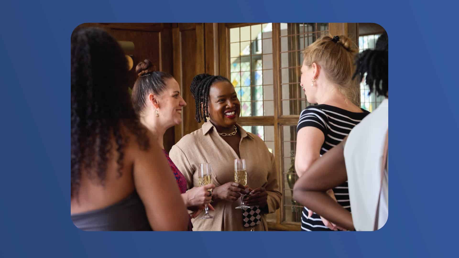 Group of diverse women engaging at Active International event in a bright room.